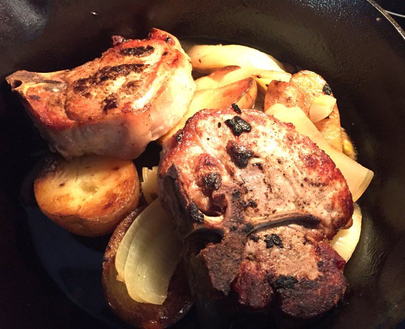 Baked pork chops with onions and potatoes